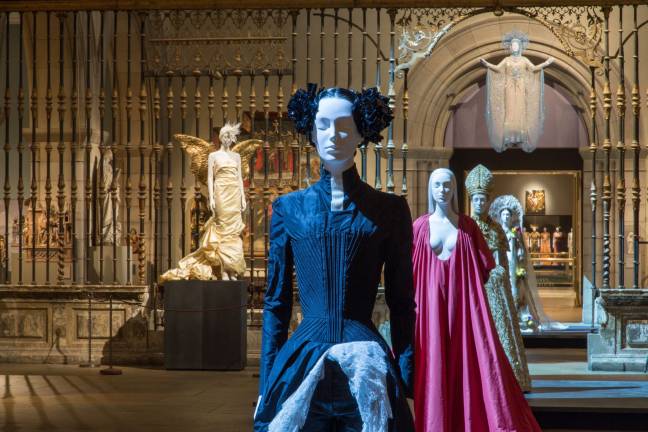 “Heavenly Bodies: Fashion and the Catholic Imagination” inside the Met Fifth Avenue's Medieval Sculpture Hall. Photo: ©The Metropolitan Museum of Art