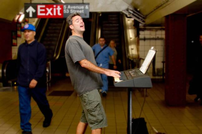Greg Schlotthauer plays piano in the subway.