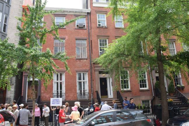 Residents and elected officials rallied Saturday in front of Chelsea's oldest home, on West 20th Street, urging the city's Landmarks Preservation Commission to reject alteration plans submitted by its new owner. Photo: Jeffrey Kopp
