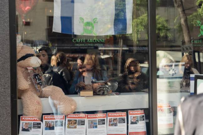 A front view of the posters, flags, and pictures on diplay at Caffe Aronne. (Priyanka Rajput)