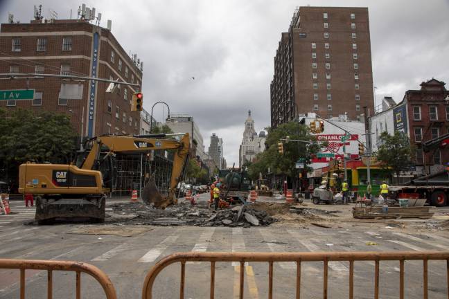 Construction and Con Edison workers were at the scene, trying to uncover the cause of the main burst.