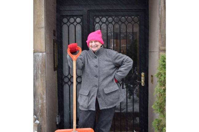 Kathryn Buck took a break from clearing snow from the walkway in front of her West 23 Street building on Tuesday morning. &#xa0;Photo: Genia Gould