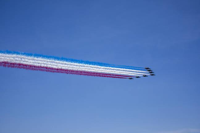 The French Air Force’s aerobatics team, the Patrouille de France, performing a flyover above the Hudson River, trailing red, white, and blue smoke. July 4 marked the culmination of their “Liberté 250” tour celebrating America’s 250th anniversary, featuring eight Dassault Alpha Jets and one Airbus A400.
