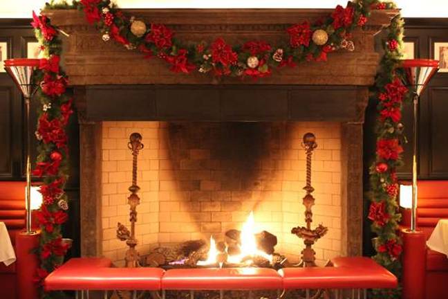 Relax by the flames at the Lambs Club, an elegant art-deco steak house