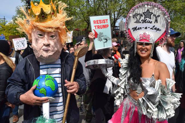 Anti-Trump protesters wore eye-catching costumes in response to Trump’s visit to the Intrepid in May. Photo: Michael Garofalo