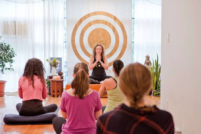 Primavera Salva leads a class at Naam Yoga. Photo: Bea Merry