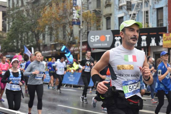 Runner 54334, Luigi Eupizi of Italy, approaching the 16th mile. Photo: Liz Hardaway