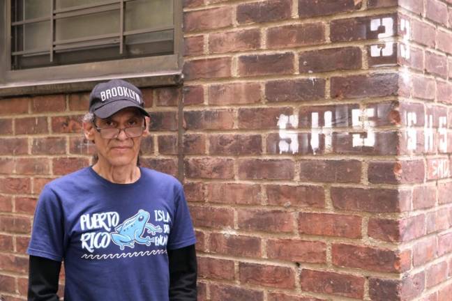 Angel Martinez in front of his Chelsea-Elliot apartment on 10th Avenue and 26th Street. Photo: Beau Matic.