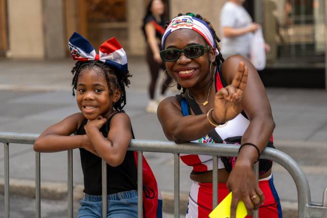 Multi-generational joy at the Dominican Day Parade.