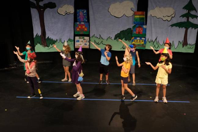 Masked campers performing in crayon colors. Photo: Emily Viega