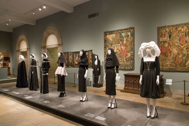 The Met's “Heavenly Bodies: Fashion and the Catholic Imagination” within the museum's Fifth Avenue Medieval Sculpture Hall. Photo: &Copy; The Metropolitan Museum of Art
