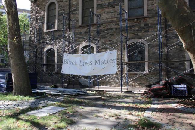 Black Lives Matter sign affixed to the scafolding. Photo: Gaby Messino