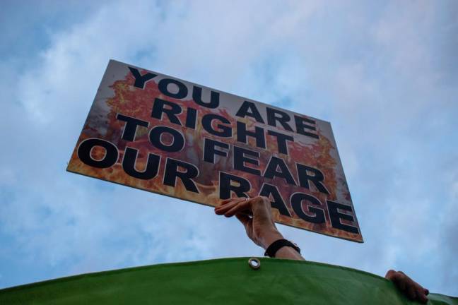 A fiery sign from the protests in Manhattan on June 24. Photo: Leah Foreman