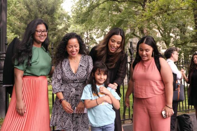 City Council Members Shahana Hanif, Alexa Avilés, and Carlina Rivera pose with Shawn Garcia’s eight year-old daughter, the star of the press conference.