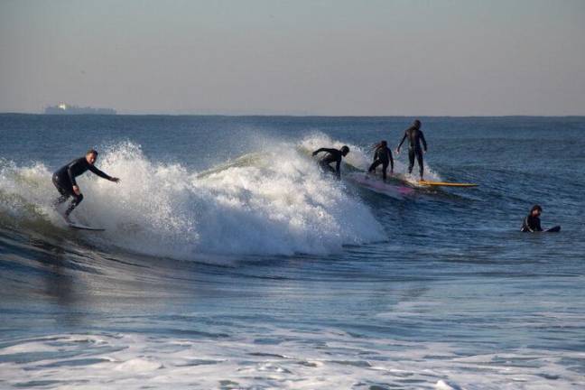 The surfing crowd at Rockaway Beach noticeably thins out in the colder months, according to Mergen. “When they leave, they take a big part of the surf community with them.”