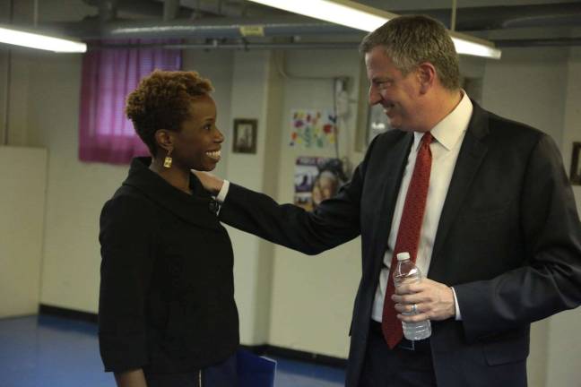 New York City Housing Authority chair Shola Olatoye with Mayor de Blasio at Lincoln Houses in Harlem when she was appointed in 2014. She is under fire after city investigators said she falsely certified that NYCHA had inspected thousands of apartments for lead paint; the mayor has been caught up in the scandal because he knew for over a year the inspections hadn't taken place, but never disclosed it. Photo: Ed Reed / Mayoral Photo Office, via flickr