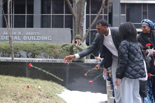 Flowers placed on monument during Black History Month at African National Burial Ground, Feb. 21, 2026.