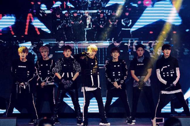 Caption: Monsta X performing in Singapore in 2015. Photo: Anna Naver via Wikimedia Commons