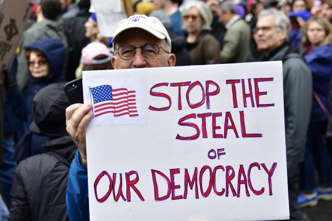 Hand-drawn signs such as this one proclaiming “Stop the Steal of Our Democracy” were common in the April 5 “Hands Off” protest in NYC, part of a national protest in all 50 states against a wide number of Trump administration policies.