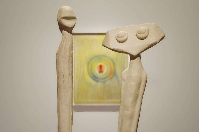 &quot;Lunar Asparagus&quot; a white-painted bronze Ernst sculpture with &quot;The Blind Swimmer.&#x201d; Photo: Adel Gorgy