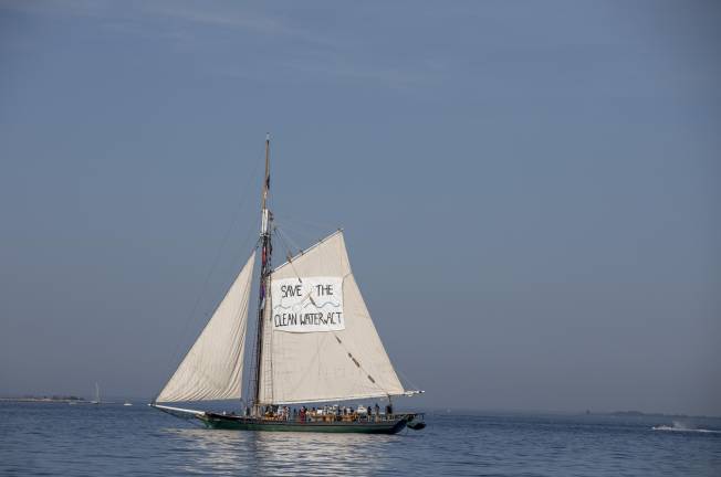 The Clearwater sloop (above) sailing south towards the Verrazzano-Narrows Bridge on the morning of the July 4th Sail Parade. Its sail reads, “Save the Clean Water Act,” as part of the organization’s efforts towards environmental advocacy.