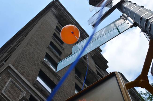 Ten blue and orange balloons were released at the unveiling of Cooper Stock Way, one for every year of Cooper's life if he were still alive. Photo by Daniel Fitzsimmons.