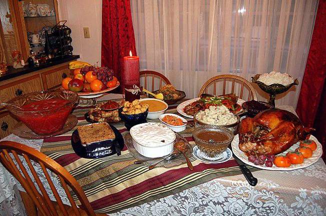 Tender, juicy roast turkey - the main attraction - with old-fashioned gravy, cranberry sauce, smashed potatoes, baked green beans, sweet and sour cod, steamed rice, achara (pickled green papaya relish), leche flan, pigs in a blanket, apple crisp (from Yucaipa!), punch and soda.
