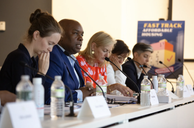 Charter Revision Commission Chair Richard Buery (second from left) speaks at the group’s last public meeting in Lower Manhattan, July 21, 2025.