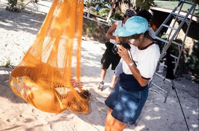 Jule Campbell takes some test photos of model Kathy Ireland during a <i>Sports Illustrated</i> Swimsuit Issue shoot in Saint Vincent and the Grenadines in the fall of 1989. Photo assistant Darren Michaels stands in the background.