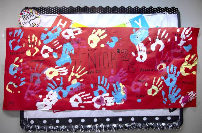 A handmade banner created by students at Repertory Company High School for Theatre Arts celebrates the graduating Seniors of 2026.