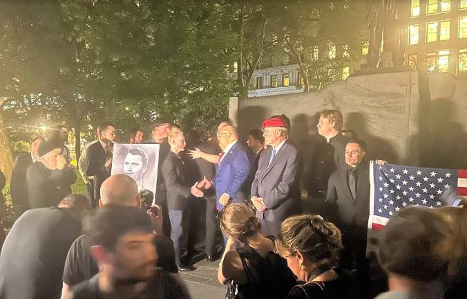 Curtis Sliwa, the Republican candidate for mayor (in red Guardian Angels beret), was among the hundreds of mourners who turned up at a memorial service for Charlie Kirk, a conservative podcaster who was assassinated by a gunman while addressing a crowd of college students in Utah.