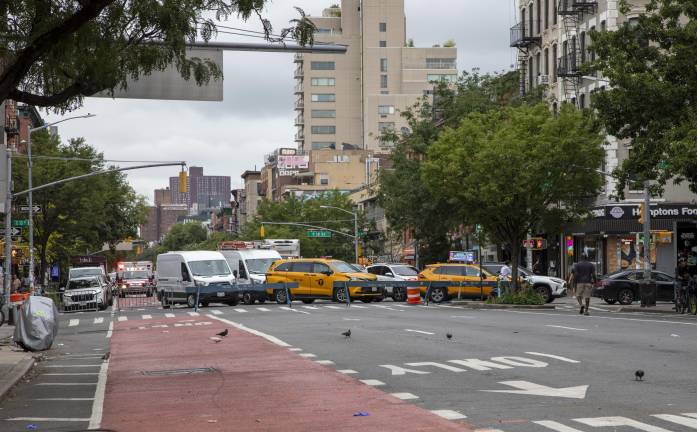 Traffic is being redirected westbound towards Second Avenue. Outside the intersection closure, there was honking and congested movement of vehicles.