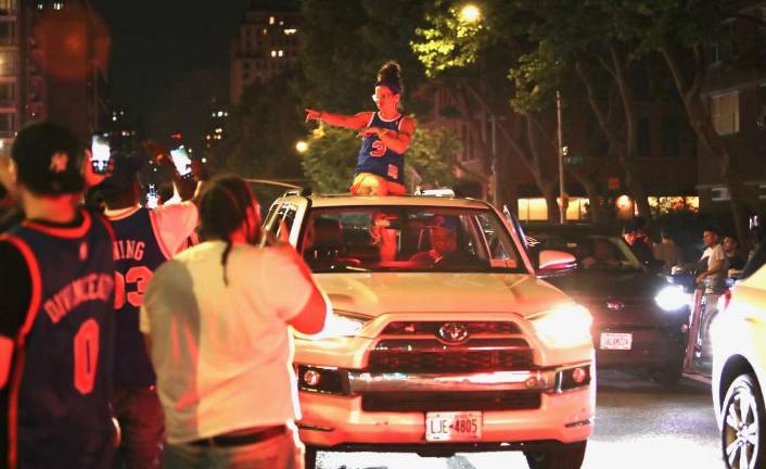 Drivers and passengers got in on the celebrations, honking and dancing out of an SUV sunroof near Madison Square Garden on June 13.