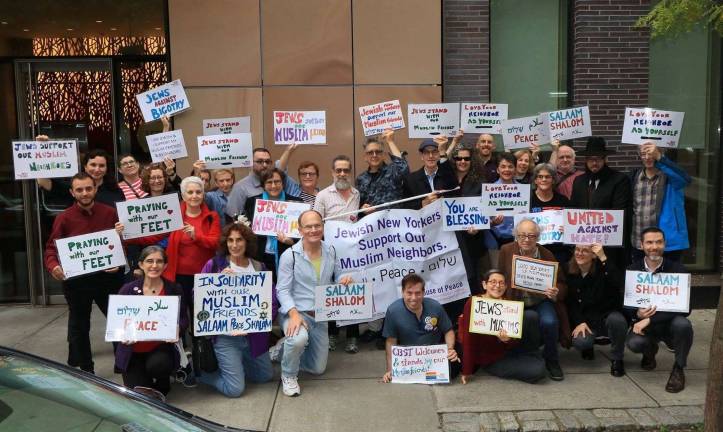 Rabbi Sharon Kleinbaum (center-left, in blue scarf) with members of Congregation Beit Simchat Torah on November 2, 2018 in front of the Islamic Center at NYU.  The congregation goes to the mosque every Friday and greets worshippers as they go to services as a sign of solidarity with Muslims. Photo courtesy of Congregation Beit Simchat Torah