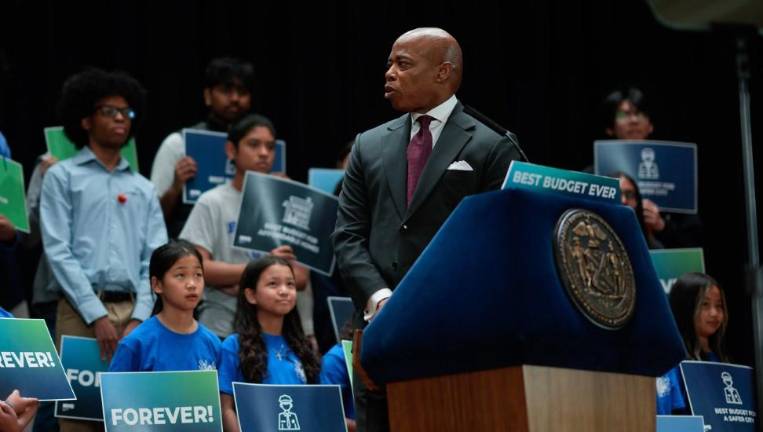 Adams unveiled an upbeat budget proposal at Bayside High School on May 1, but it drew some criticism for downplaying looming financial storm clouds.