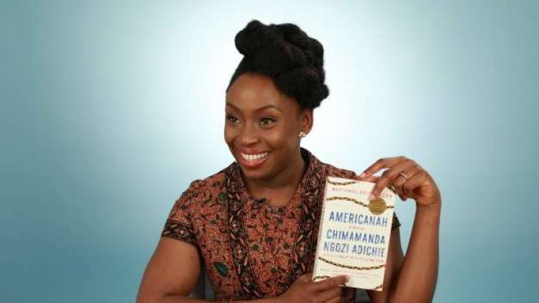 Adichie with her book. Photo: Danny Menendez for BuzzFeed &#xa0;