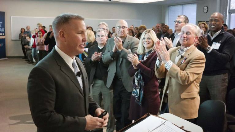 Justin Constantine receives a standing ovation after a presentation to the leadership team at Motel 6 in Plano, TX.