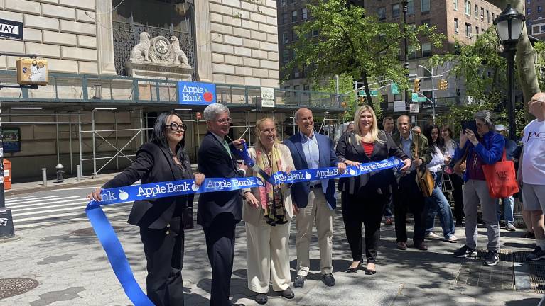 Ribbon cutting for the inauguration of the new display drew (from left) Apple Bank marketing director Judy Edelson, CEO Steven C. Bush, and City Council Member Gale Brewer.