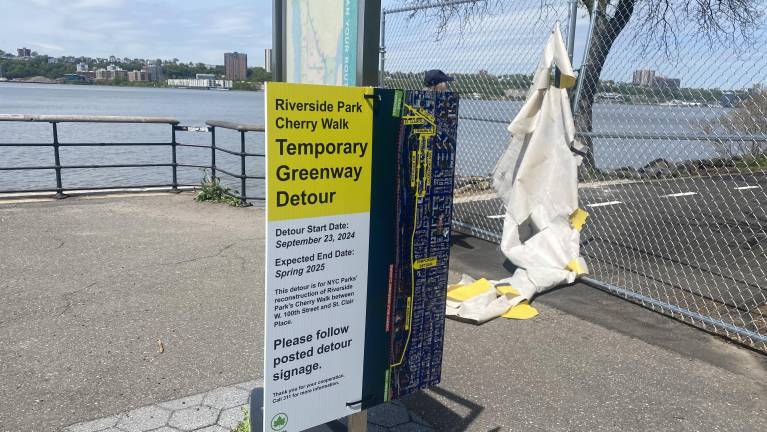 A sign earlier this year that indicated the path would soon be reopened.