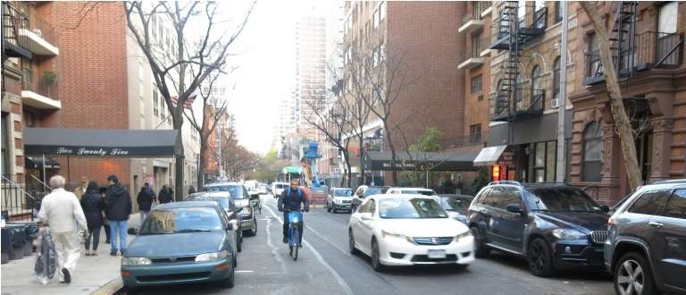 An unprotected, one-way bike lane on the Upper East Side. The city's Department of Transportation is now developing a series of proposals for crosstown bike routes to be unveiled "in the near future." Currently, the best-known bikeways are on the north-south avenues, and the new plan would introduce them in greater number to the east-west cross streets. Photo: Community Board 8
