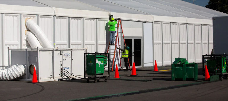 Workers ertected migrant tents on Randall’s Island in October 2022 as the city wrestled with the influx of over 225,000 asylum seekers who desceded on the city during the migrant crisis. The tents came down last year and four soccer fields were restored this sprint.