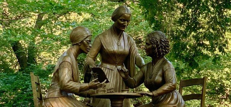 The monument honors three women activists: (from left) Sojourner Truth speaking, Susan B. Anthony organizing, and Elizabeth Cady Stanton writing.
