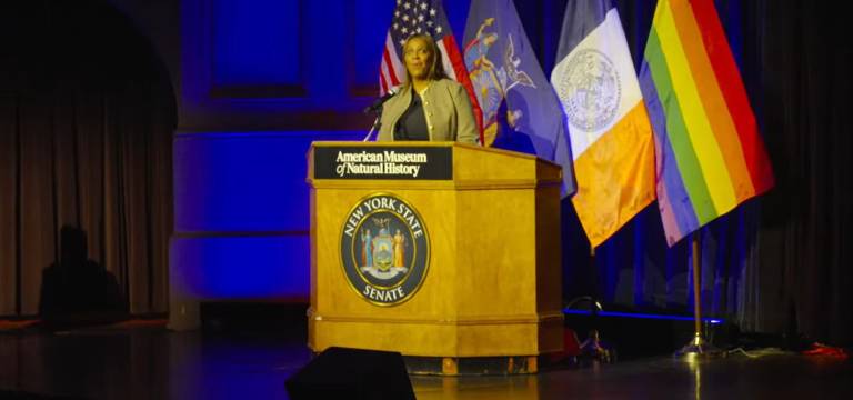 New York State Attorney General Letitia James speaking after a standing ovation at State Senator Erik Bottcher’s inauguration ceremony at the AMNH.