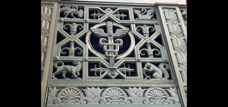Stunning Art Deco grillwork on building exterior. Note the fauna!