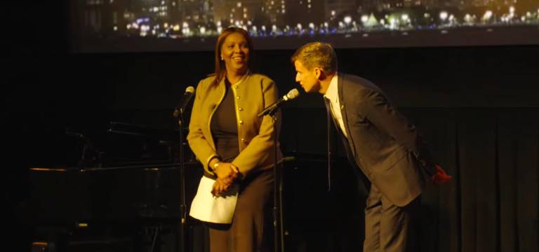 New York State Senator Erik Bottcher singing “Love Sweet Love” with Letitia James before taking the oath of office at the AMNH.
