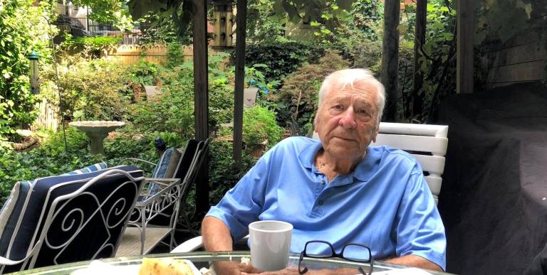 George Capsis relaxing in his beloved garden at 69 Charles St.