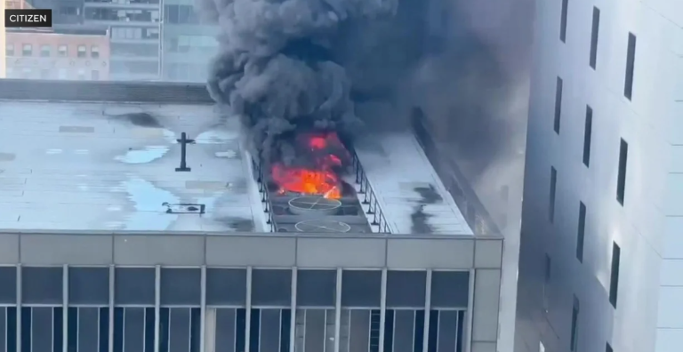 Flames shoot from the cooling towers of a high rise at 6 E. 43rd St. around 9:45 a.m. only a block away from the St. Patrick’s Day Parade which started on time at 11 a.m. at Fifth and 44th St. on March 17.