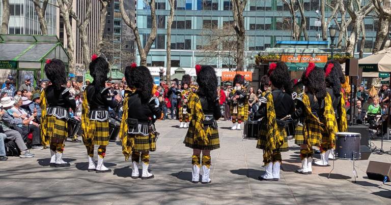 Tartan Day Parade pipers warm up in Bryant Park.