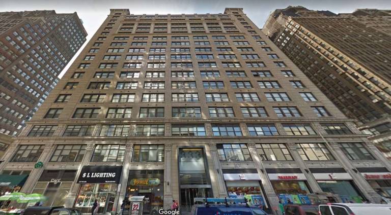 A recent photo of an office tower on Seventh Avenue in Chelsea. The ordinary-looking 1920 building masks its colorful history as the hub of the city&#x2019;s Fur District for more than half-a-century. Photo: Google Street View