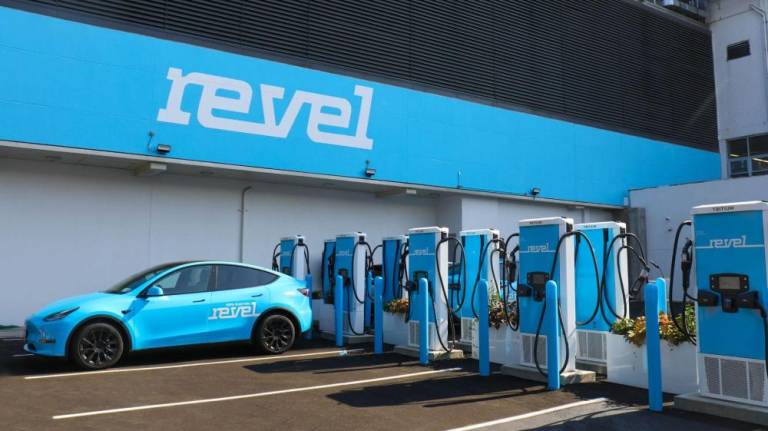 A new “superhub” charging station, similar to this one the electric vehicle maker operates in Bedford Stuyvesant will soon be coming to Pier 36 on the Lower East Side, compatible with all EVs. Photo: Revel